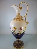 Royal Worcester C.1903 leadless glaze ornate handled jug. The Gilded scrolled handle leading to a