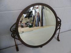 Bronze patinated wall mirror in the manner of Edgar Brandt with scroll work sides.