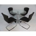Glass Round Pedestal table and four chrome and black leatherette 'Cantilever type chairs