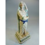 Staffordshire pearlware figure on a goddess type lady with one arm raised on head. Dressing in a