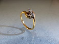 Two stone diamond crossover ring. Size N.5