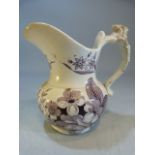 Creamware milk jug in purple transfer with scrolling handle.