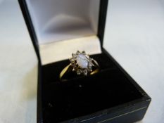 Ladies 9ct Gold ring (size M) with oval central Opal