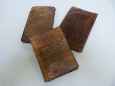 Crocodile skin wallet along with two others in calf leather
