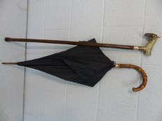 Black umbrella with 9ct Gold band along with a walking stick with resin carved horse handle