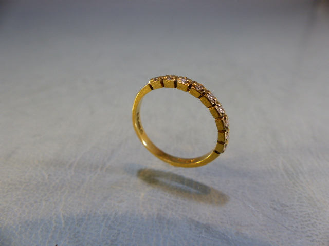 18ct Gold half Eternity ring set with 9 diamonds. Size L