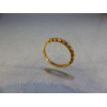 18ct Gold half Eternity ring set with 9 diamonds. Size L