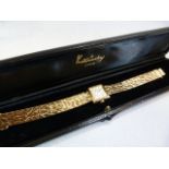 Kutchinsky: A ladies Kutchinsky of London 9ct GOLD dress watch (total weight approx 30.3g) with both
