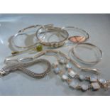 Six hallmarked silver bracelets and a single silver earring Approx weight - 68.4g