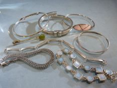 Six hallmarked silver bracelets and a single silver earring Approx weight - 68.4g