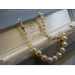 String of white pearls with 9ct Gold clasp in presentation case