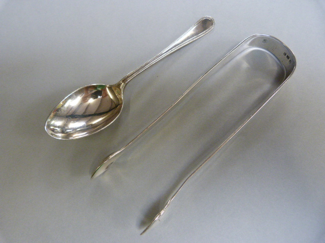 Hallmarked silver teaspoon by James Deakin & Sons Sheffield 1924 and a hallmarked silver set of