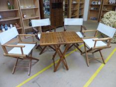 Teak chequered table and four 'Director' chairs