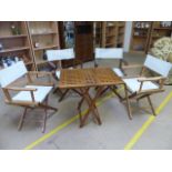 Teak chequered table and four 'Director' chairs