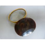 Tortoise shell and bone bound magnifying glass with small chip to glass