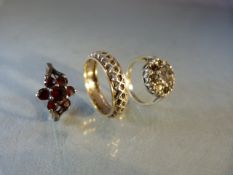 Two silver rings and a gold & silver eternity ring (A/F)