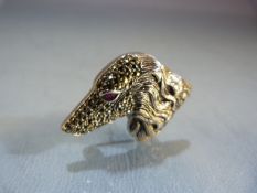 Silver and marcasite brooch of a dogs head with a ruby eye