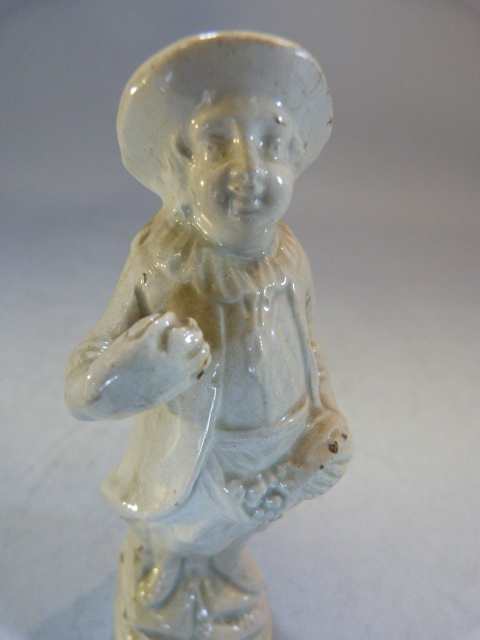 Two Staffordshire pottery 'Blanc de Chine; figures modelled as a large man carrying grapes and a - Image 17 of 18