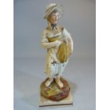 Enamel painted pearlware figure poss Neale of an Agricultural working lady stood on Pratt coloured
