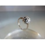 White Gold single stone diamond ring (size I) of approx 30 points on a raised column setting