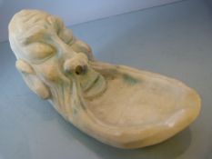 Comical Ashtray poss Alabaster in the form of an oriental man. His Beard being the tray.
