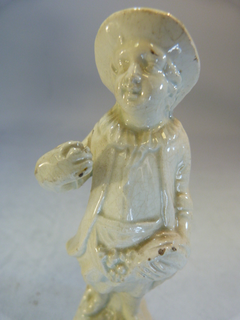 Two Staffordshire pottery 'Blanc de Chine; figures modelled as a large man carrying grapes and a - Image 12 of 18