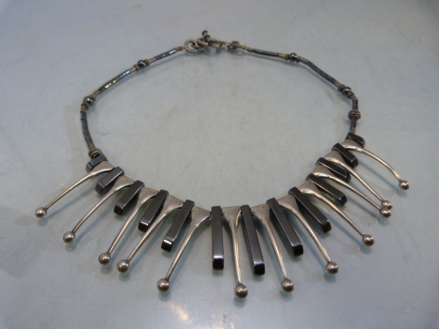 White metal (possibly Foreign Silver) and Haematite Cleopatra Fringe Necklace: Consisting of 12