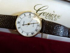 A 9ct gents Geneve wrist watch with date dial in presentation case