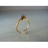Single solitaire diamond ring on gold band (hallmarks rubbed) size P