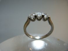 Three Stone Diamond Trilogy on Platinum 950 ring (size N) with good quality stones of total approx