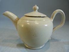 Creamware miniature teapot and cover. Large loop handle. Damage to underside of cover