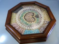 Good 19th Century Sailors' Shell Work Valentine. Mounted in a Hexagonal mahogany frame.