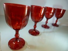 Set of Four heavy cranberry glass facet stemmed wine glasses along with a clear glass antique