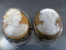 Two silver Vintage cameo brooches (1) measuring approx 33mm x 25.25mm across, female head facing