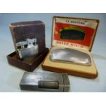 Three Vintage Lighters: A boxed French "le nouveau Silver Match"; a boxed Ronson "Princess" and a
