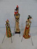 Three Indonesian articulated puppets on stands