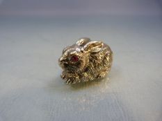 Silver figure of a Rabbit with Ruby eyes marked Sterling to base