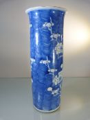 A Chinese kangxi style sleeve vase painted with prunus blossom, two concentric rings painted to