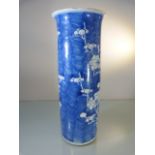 A Chinese kangxi style sleeve vase painted with prunus blossom, two concentric rings painted to