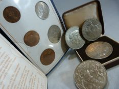 Three silver crowns, along with a hallmarked silver coin commemorating the marriage of the Prince of