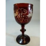 Antique cranberry wine glass of small form with Wheel cut decoration