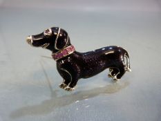 Silver and enamel set brooch in the form of a Dachshund with Ruby collar