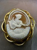 Large Victorian Pinchbeck, very fine brown Cameo Brooch depicting Erato playing her Lyre. Erato is