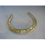 Silver and Peridot tennis bracelet (total length approx 19.5cm)