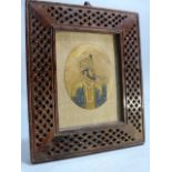 19th Century Mughal Ivory miniature mounted in a pierced work wooden frame.