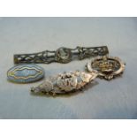 Four silver brooches to include a sweetheart brooch and an enamelled brooch and a sailing ship by