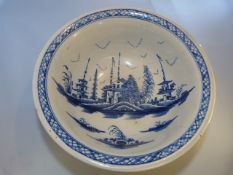 Pearlware bowl of large form painted in Underglaze blue with fence pattern rim. Decorated to outside