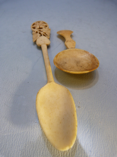 Antique carved medicine spoon and one other with long stem leading to a floral pierced top. - Image 2 of 5