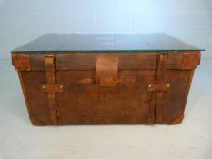 Antique travel trunk with leather straps (comes with glass top)