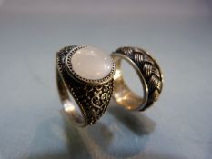 Two hallmarked silver rings - 1 set with moonstone. Approx weight - 8.8g